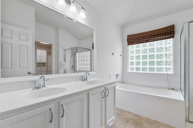 1102 Peyton Pl, Cedar Park, TX 78613 - bathroom with a garden tub, a stall shower, double vanity, and vaulted ceiling
