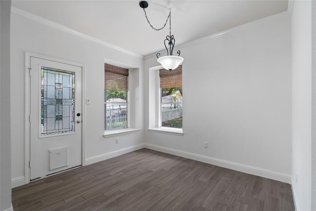 1102 Peyton Pl, Cedar Park, TX 78613 - unfurnished dining area featuring plenty of natural light, dark wood-type flooring, and crown molding