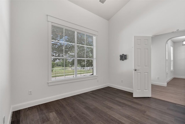 1102 Peyton Pl, Cedar Park, TX 78613 - unfurnished room with dark wood-style floors, arched walkways, and vaulted ceiling