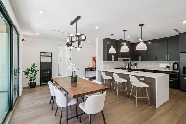 5700 Louise Ln, Austin, TX 78757 - dining space with light wood-type flooring and recessed lighting
