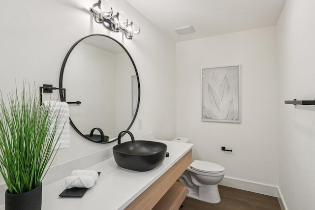 5700 Louise Ln, Austin, TX 78757 - bathroom featuring vanity and wood finished floors