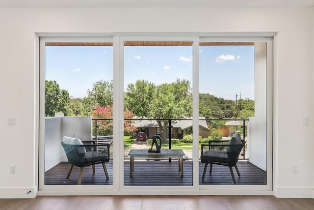 5700 Louise Ln, Austin, TX 78757 - doorway featuring wood finished floors and baseboards