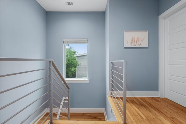 7606 Providence Ave Unit B, Austin, TX 78752 - stairs featuring wood finished floors and baseboards