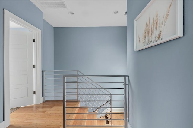 7606 Providence Ave Unit B, Austin, TX 78752 - stairs with wood finished floors and recessed lighting