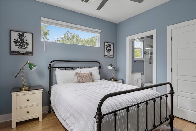 7606 Providence Ave Unit B, Austin, TX 78752 - bedroom with light wood-style floors, connected bathroom, and ceiling fan