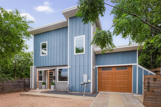 7606 Providence Ave Unit B, Austin, TX 78752 - modern home with a garage, concrete driveway, and board and batten siding