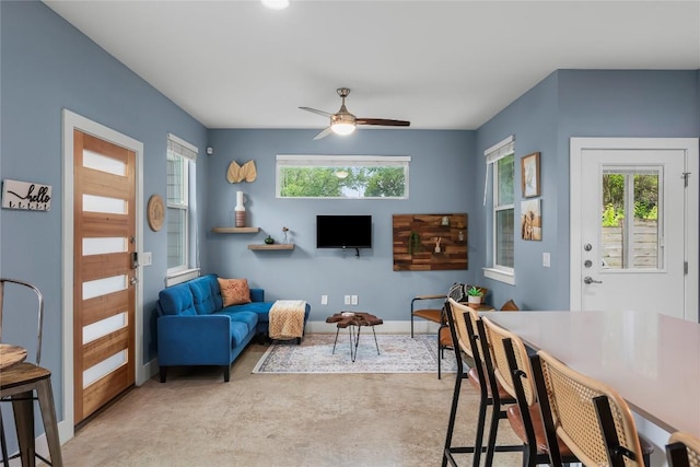 7606 Providence Ave Unit B, Austin, TX 78752 - living room featuring finished concrete floors, plenty of natural light, and ceiling fan