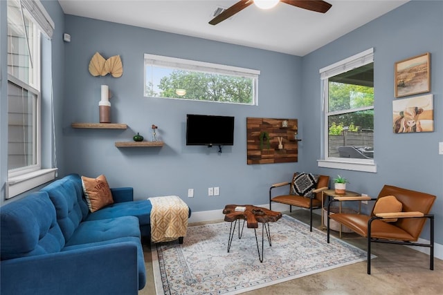7606 Providence Ave Unit B, Austin, TX 78752 - living area featuring a ceiling fan and baseboards