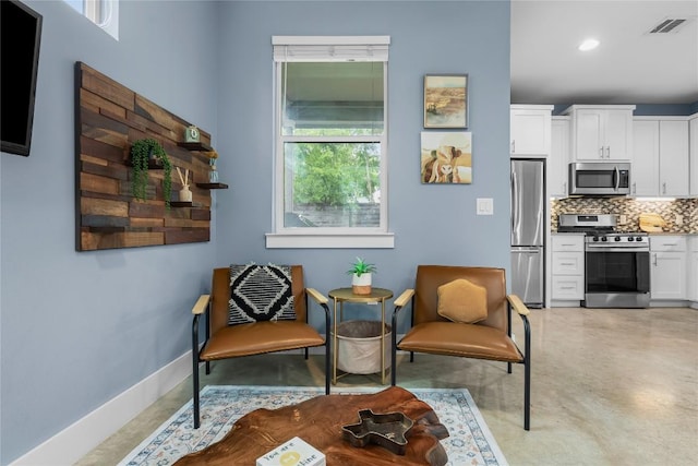 7606 Providence Ave Unit B, Austin, TX 78752 - sitting room with concrete flooring and recessed lighting