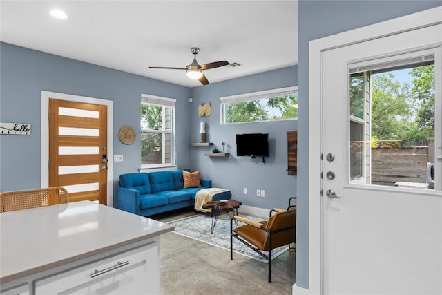 7606 Providence Ave Unit B, Austin, TX 78752 - living area with ceiling fan and baseboards