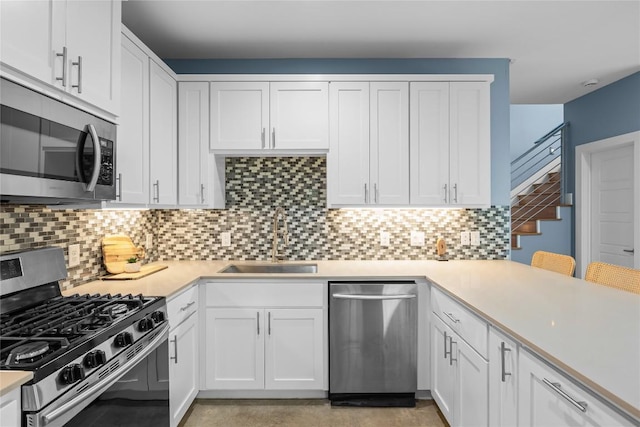 7606 Providence Ave Unit B, Austin, TX 78752 - kitchen with stainless steel appliances and white cabinetry