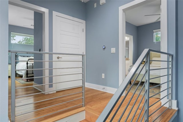 7606 Providence Ave Unit B, Austin, TX 78752 - corridor with wood finished floors and an upstairs landing