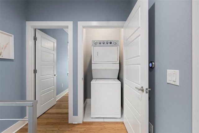7606 Providence Ave Unit B, Austin, TX 78752 - washroom with stacked washer / dryer and light wood-type flooring