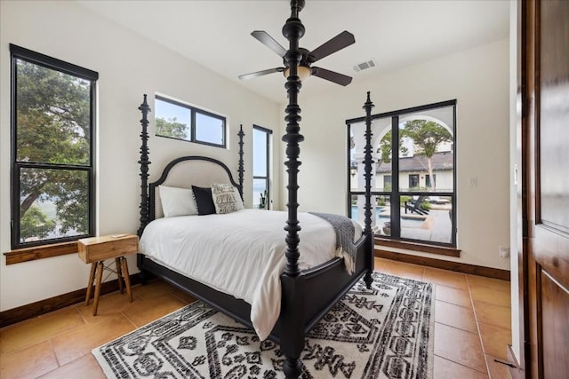 bedroom featuring light tile patterned floors and a ceiling fan