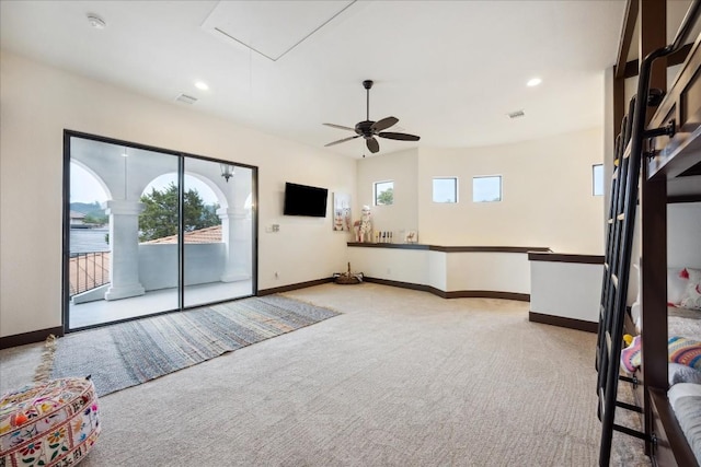 unfurnished room with light carpet, plenty of natural light, attic access, ceiling fan, and recessed lighting
