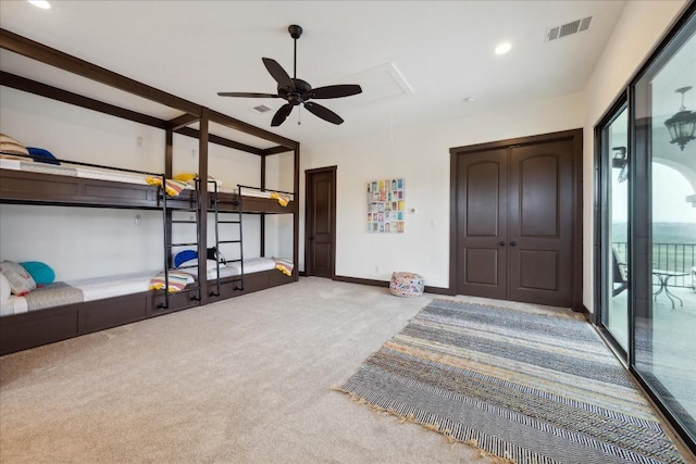bedroom featuring attic access, carpet floors, access to exterior, a closet, and recessed lighting