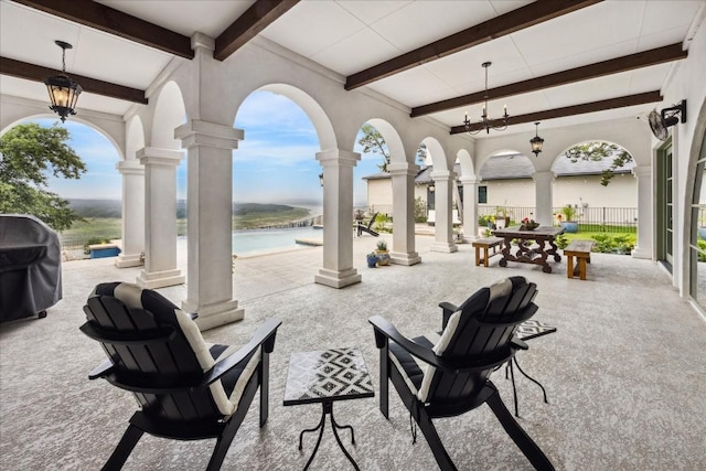 view of patio with a water view