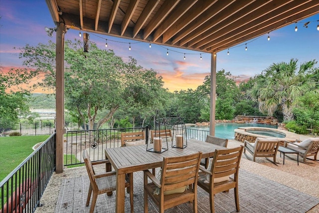 17120 Northlake Hills Dr, Jonestown, TX 78645 - patio terrace at dusk with an in-ground hot tub, an outdoor pool, and outdoor dining space