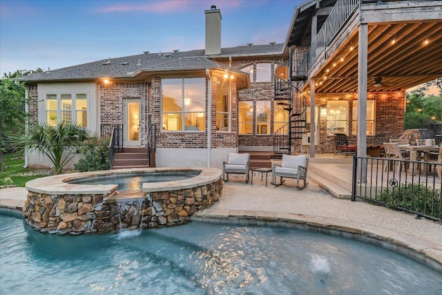 17120 Northlake Hills Dr, Jonestown, TX 78645 - pool at dusk featuring a patio, stairs, ceiling fan, and a pool with connected hot tub