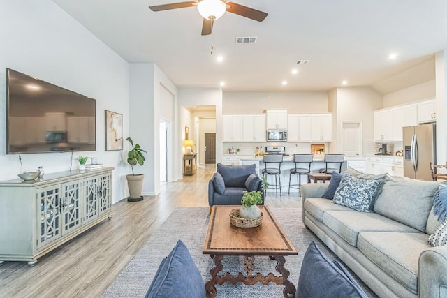 7901 Sunrise Ravine Pass, Lago Vista, TX 78645 - living room with ceiling fan, light wood-style floors, and recessed lighting