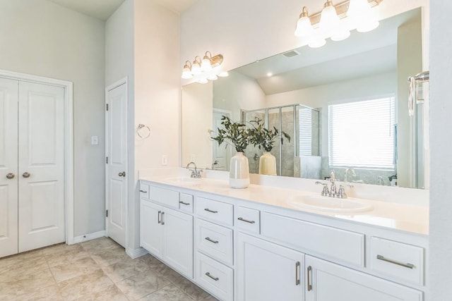 7901 Sunrise Ravine Pass, Lago Vista, TX 78645 - bathroom featuring a shower stall and double vanity