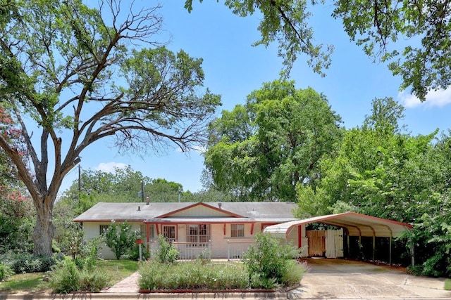 4705 Enchanted Ln, Austin, TX 78745 - view of front facade featuring a detached carport and driveway