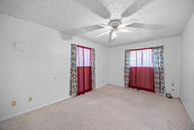 4705 Enchanted Ln, Austin, TX 78745 - empty room featuring healthy amount of natural light, carpet floors, a ceiling fan, and a textured ceiling