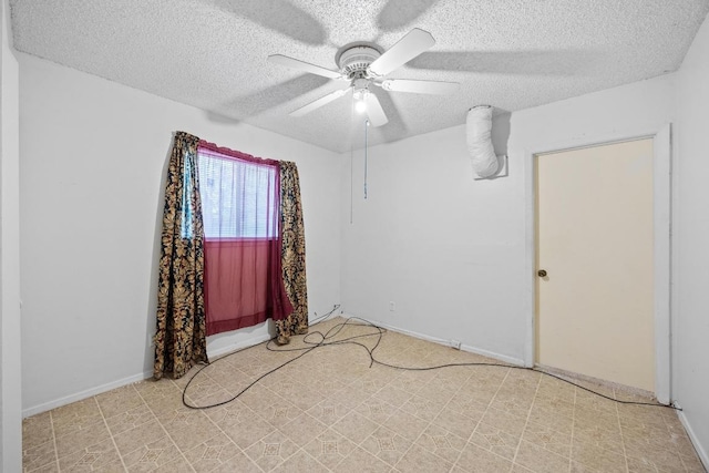 4705 Enchanted Ln, Austin, TX 78745 - empty room featuring a textured ceiling, ceiling fan, and tile patterned floors