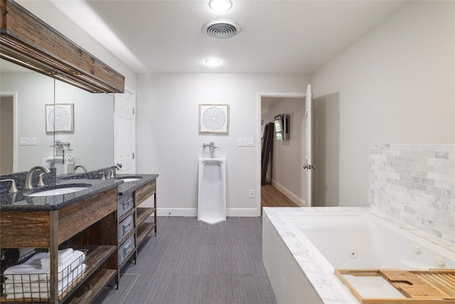 2119 Rabb Rd, Austin, TX 78704 - full bath featuring double vanity and a jetted tub