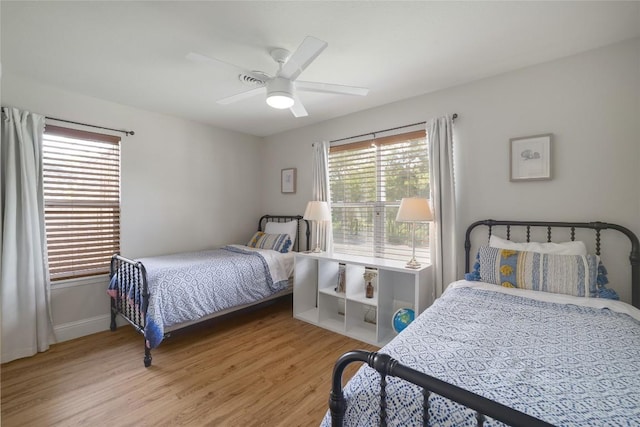 2119 Rabb Rd, Austin, TX 78704 - bedroom with wood finished floors and ceiling fan