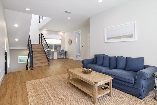 2119 Rabb Rd, Austin, TX 78704 - living room with wood finished floors, recessed lighting, stairs, and plenty of natural light