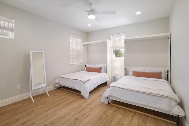 2119 Rabb Rd, Austin, TX 78704 - bedroom featuring multiple windows, light wood finished floors, ceiling fan, and recessed lighting