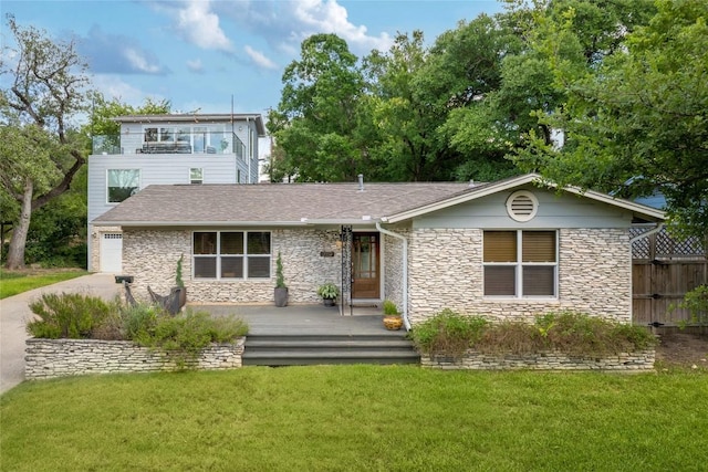2119 Rabb Rd, Austin, TX 78704 - view of front of property featuring stone siding, concrete driveway, a garage, and roof with shingles