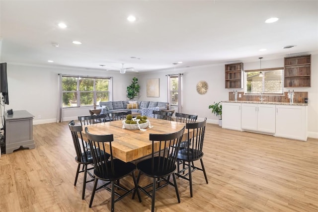 2119 Rabb Rd, Austin, TX 78704 - dining space featuring recessed lighting, light wood-style flooring, and ornamental molding