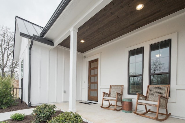 106 Double Eagle Ranch Dr, Cedar Creek, TX 78612 - doorway to property featuring board and batten siding and covered porch