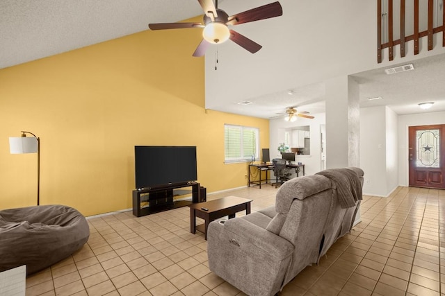 2810 Goldbridge Dr, Austin, TX 78745 - living area featuring light tile patterned floors, high vaulted ceiling, and a ceiling fan
