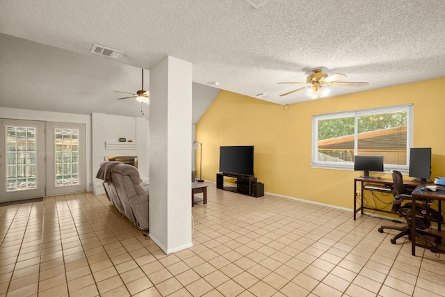 2810 Goldbridge Dr, Austin, TX 78745 - office with ceiling fan, light tile patterned floors, a textured ceiling, french doors, and lofted ceiling