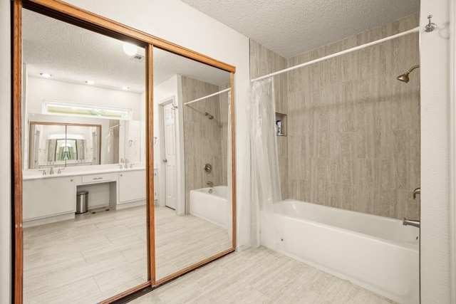 2810 Goldbridge Dr, Austin, TX 78745 - full bathroom with a textured ceiling, shower / tub combo with curtain, and vanity