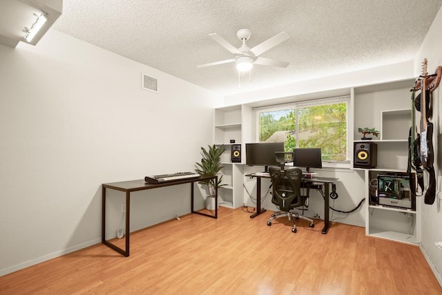 2810 Goldbridge Dr, Austin, TX 78745 - office area with wood finished floors, a textured ceiling, and a ceiling fan