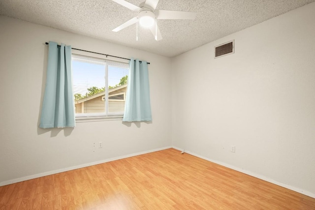 2810 Goldbridge Dr, Austin, TX 78745 - spare room featuring a textured ceiling, wood finished floors, and ceiling fan