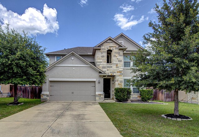 5821 Viejo Dr, Austin, TX 78738 - view of front facade with stone siding, stucco siding, and driveway
