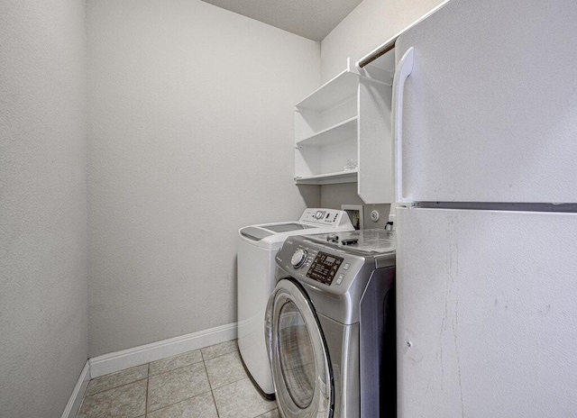 5821 Viejo Dr, Austin, TX 78738 - washroom with washing machine and dryer and light tile patterned floors
