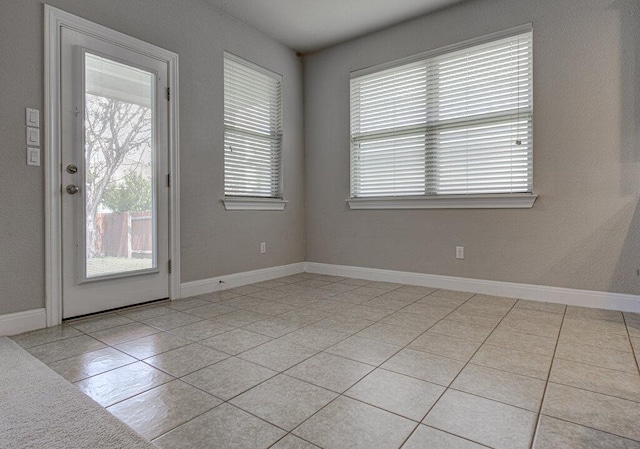 5821 Viejo Dr, Austin, TX 78738 - empty room with healthy amount of natural light and light tile patterned floors