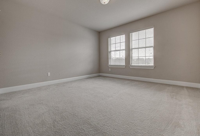 5821 Viejo Dr, Austin, TX 78738 - empty room with baseboards and light carpet