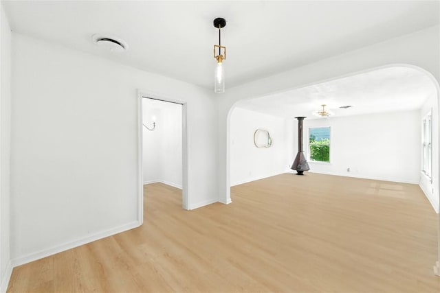 1302 S 2nd St, Killeen, TX 76541 - empty room featuring arched walkways and light wood finished floors