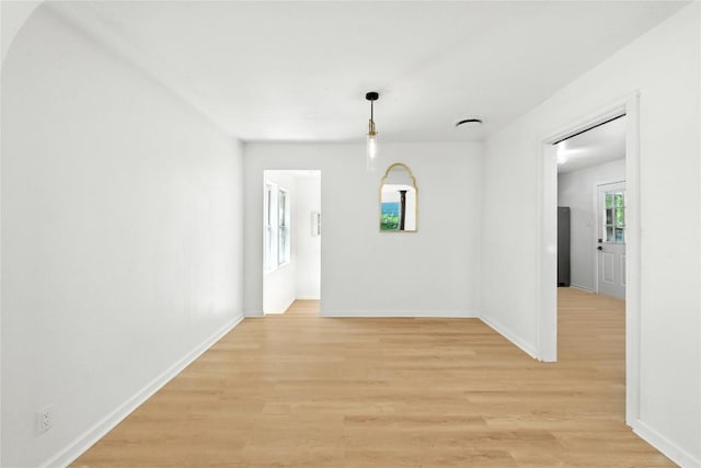 1302 S 2nd St, Killeen, TX 76541 - unfurnished dining area featuring light wood-style flooring and baseboards
