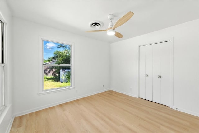 1302 S 2nd St, Killeen, TX 76541 - unfurnished bedroom with light wood-style floors, a closet, and a ceiling fan