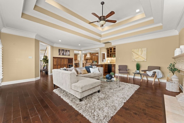 4206 River Place Blvd, Austin, TX 78730 - living room with a tray ceiling, a ceiling fan, wood finished floors, ornamental molding, and recessed lighting