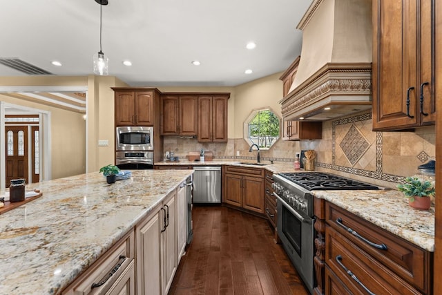 4206 River Place Blvd, Austin, TX 78730 - kitchen with stainless steel appliances, custom exhaust hood, light stone counters, dark wood-type flooring, and recessed lighting