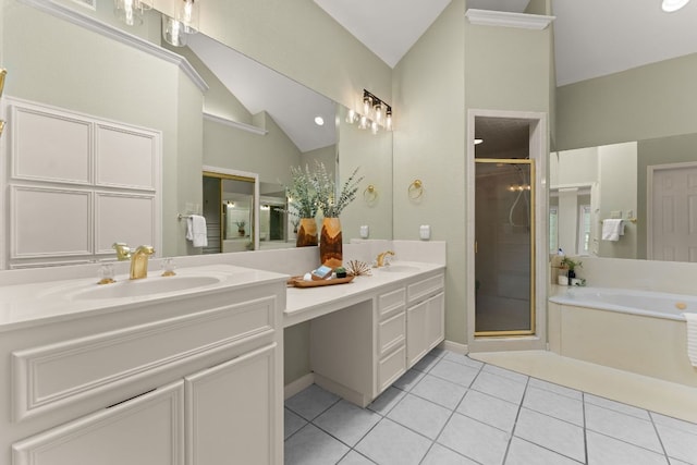 4206 River Place Blvd, Austin, TX 78730 - bathroom with lofted ceiling, double vanity, a stall shower, a garden tub, and tile patterned floors